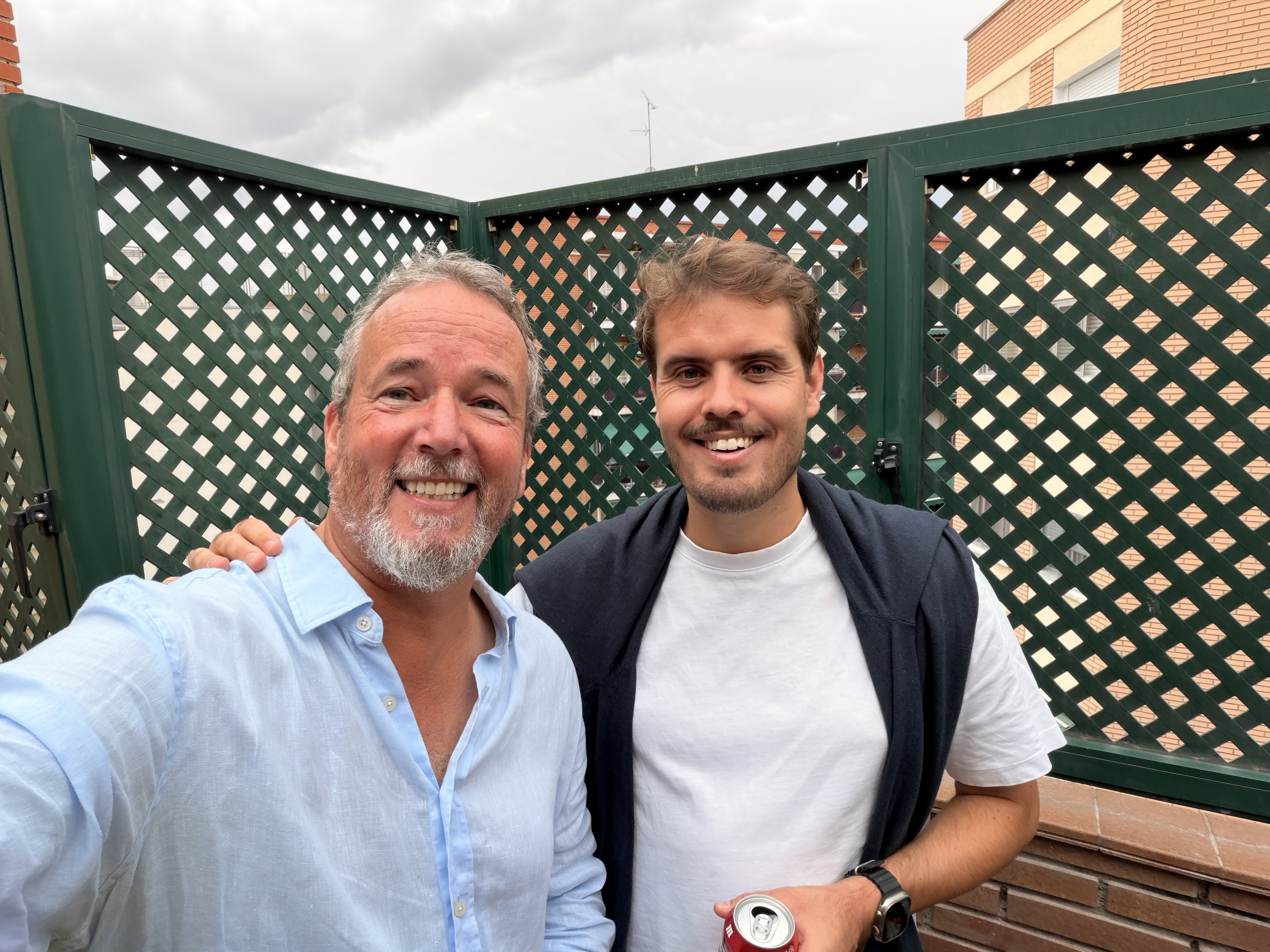 Two friends together on a terrace